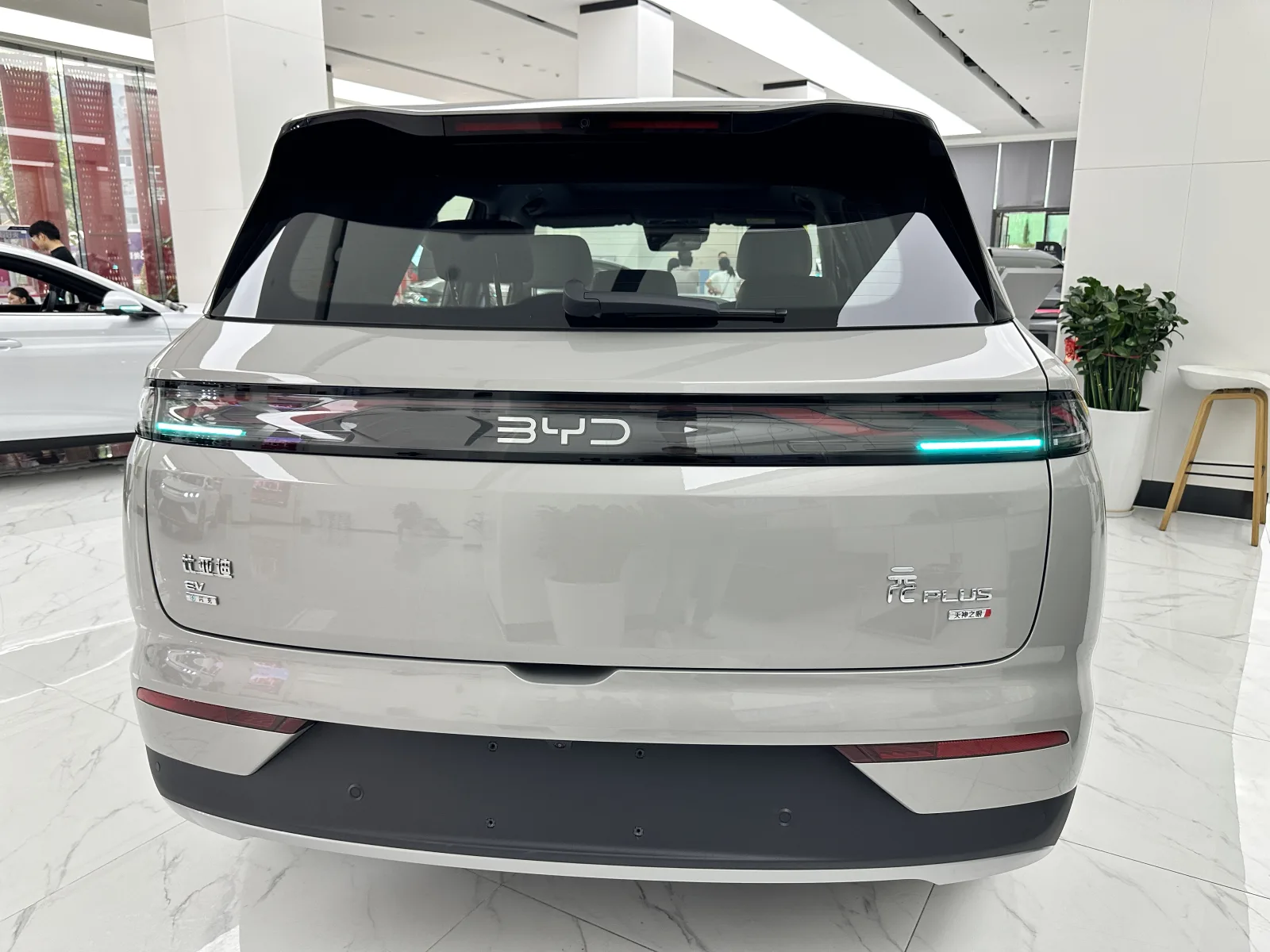 BYD Yuan PLUS rear view in a vehicle showroom