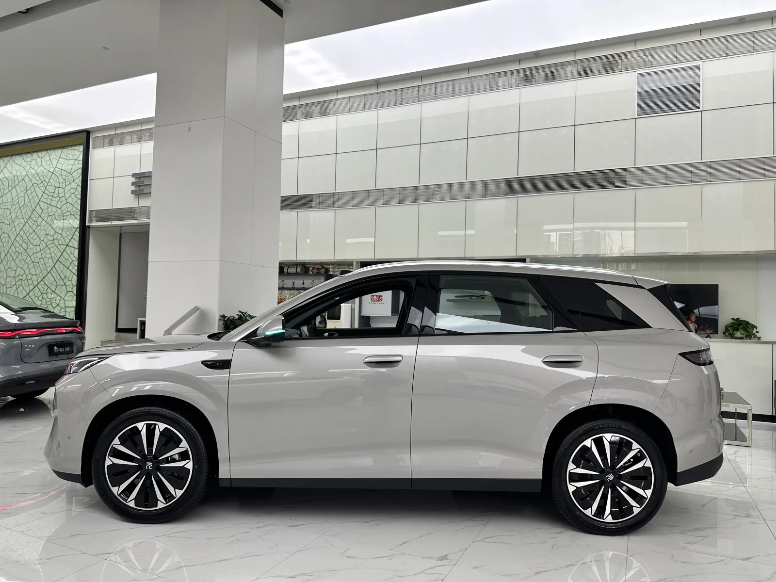 BYD Yuan PLUS side profile in a vehicle showroom