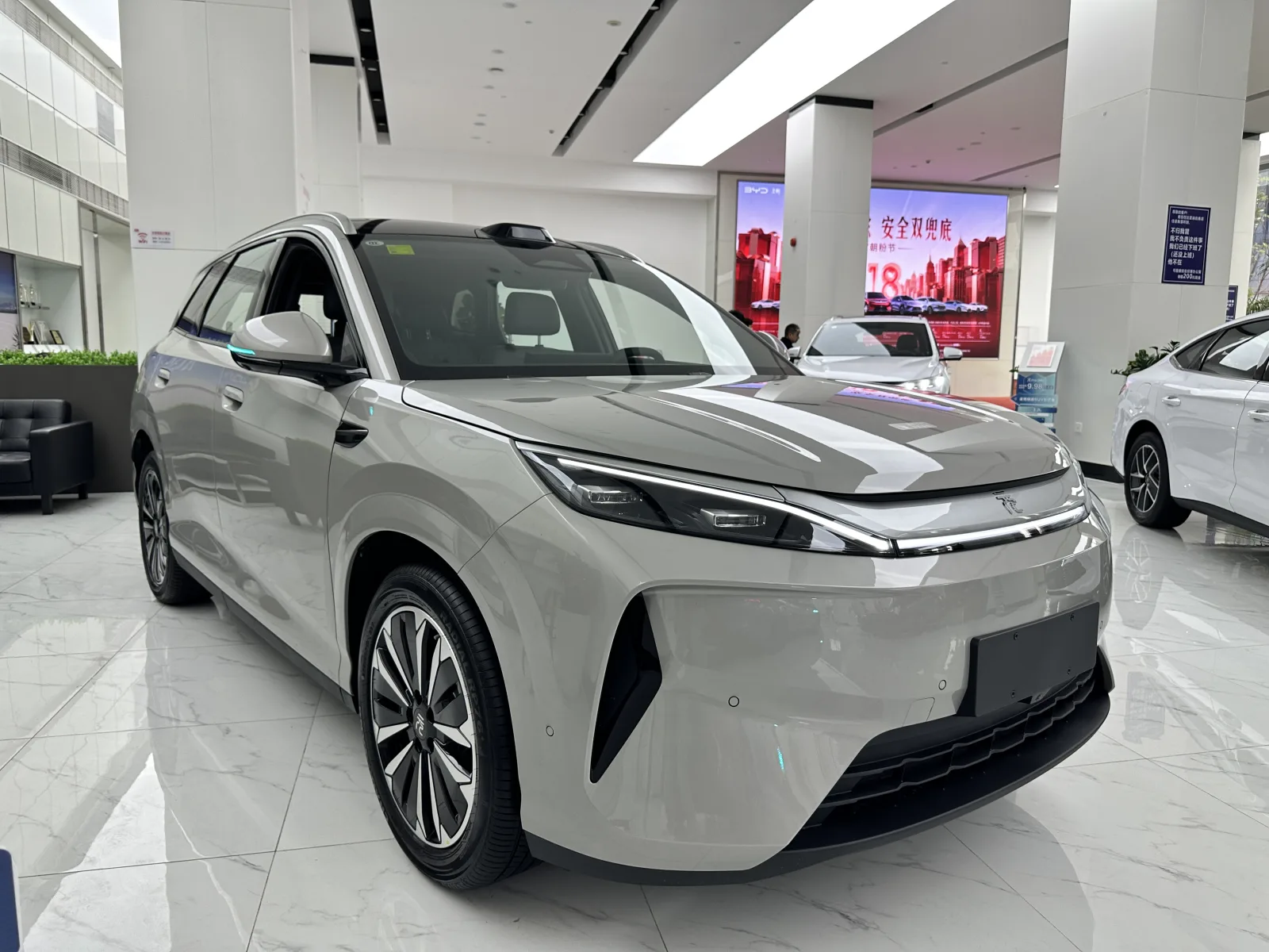BYD Yuan PLUS front three-quarter view in a vehicle showroom